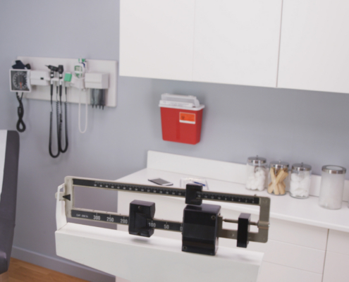 Close Up Of Medical Office Cabinets And Equipment. Interior Hospital Room With Medical Instruments